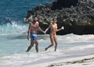 Taylor Swift Was Photographed Kissing Travis Kelce in a Yellow Bikini on Vacation
