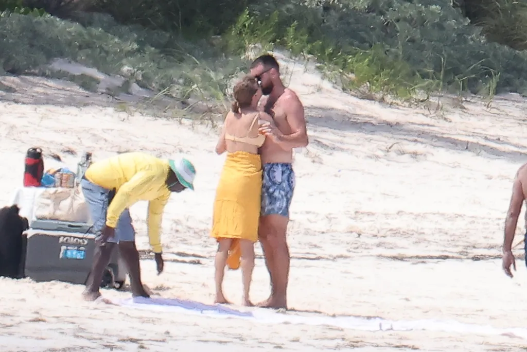 Taylor Swift Was Photographed Kissing Travis Kelce in a Yellow Bikini on Vacation